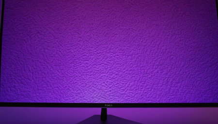 Purple wall with a black screen in the studio, closeupの素材
