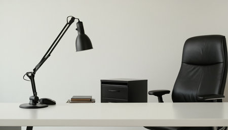 Office desk with a black armchair and a table lamp. 3d renderingの素材