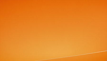 Orange sky with thin white lines. Background and texture for design.の素材