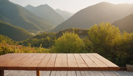 Wooden table against scenic view of mountains and valley in the morningの素材