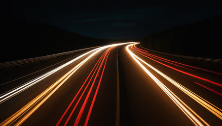 Car light trails in tunnel. Long exposure photo taken in a tunnel.の素材