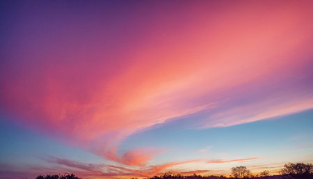 Beautiful sunset over the winter field. Colorful sky background.の素材