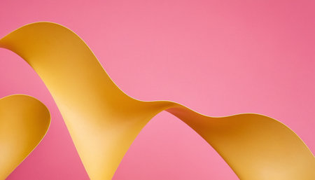 Yellow curved paper on a pink background. Minimalistic concept.の素材