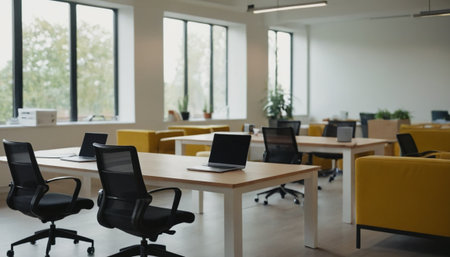 Modern coworking office interior with computers and chairs. Blurred backgroundの素材