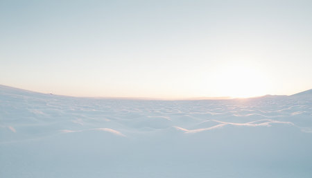 Beautiful winter landscape with snowdrifts and blue sky with cloudsの素材