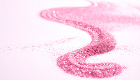 Pink glitter nail polish on a white background close-up macro photoの素材