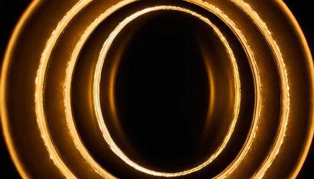 Abstract light lines on a black background. Yellow lights on a black backgroundの素材