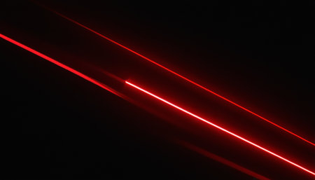 Abstract red lines on a black background. Laser lines in the dark.の素材