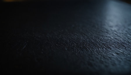 Close up of black textured surface. Abstract background for design.の素材