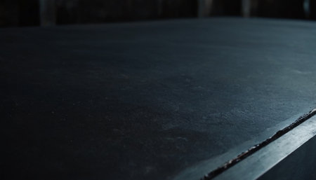 Close up of a black metal surface in a factory, shallow depth of fieldの素材
