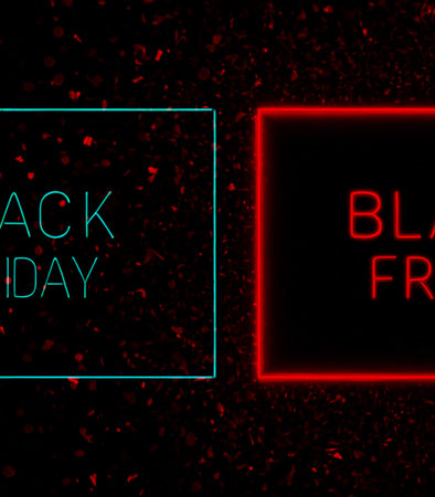 Black friday sale banner with red neon lights on black background.の素材