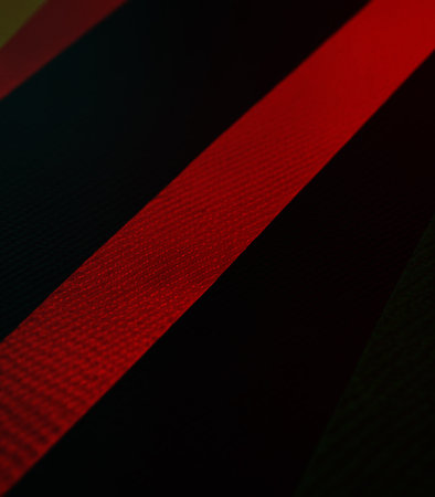 red and black stripes on a black background, closeup of photoの素材