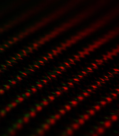 abstract background of red and black lines in a grid of lightの素材
