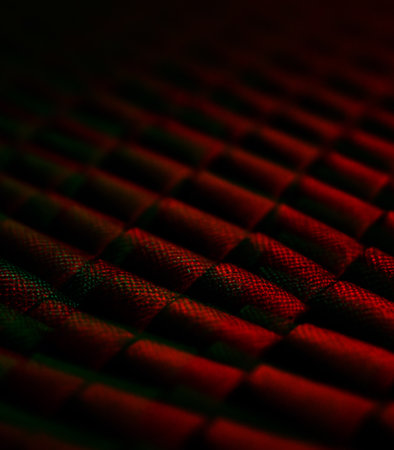 abstract background: red and black carbon fiber, close-upの素材