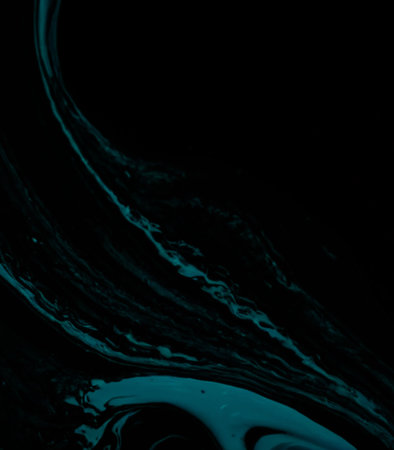 Blue paint mixing on black background. Fluid art. Abstract pattern.の素材