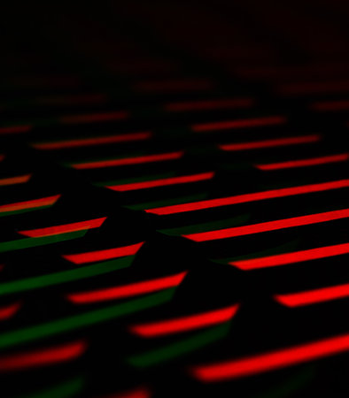 Abstract background of red and green neon strips in the form of a gridの素材