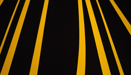 Black and yellow stripes on a black background. Abstract background for design.の素材