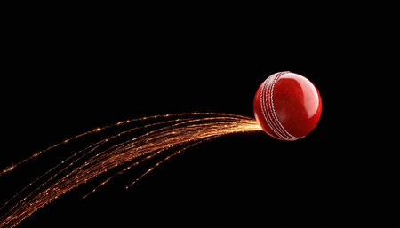 Cricket ball flying through the air with a trail of particlesの素材