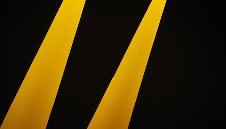 Yellow and black stripes on a black background. 3d render.の素材