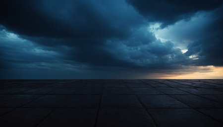 Empty square floor with dramatic sky background. Perspective view of dark cloudy sky background.の素材