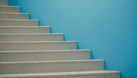 Staircase on blue wall background. Close-up view.の素材