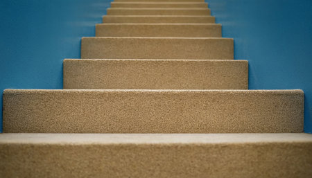Concrete stairs with blue wall in background, shallow depth of fieldの素材