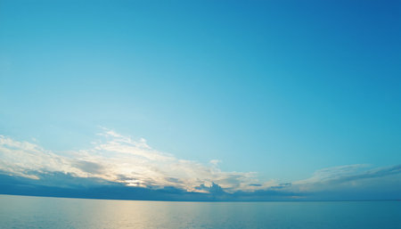 beautiful sunset over the sea, blue sky with clouds and sunの素材