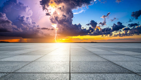 Empty square floor and dramatic sky with lightning at sunset,high angle viewの素材