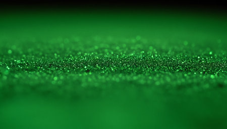 green glitter bokeh defocused lights background. abstract glitter twinkled bright background.の素材