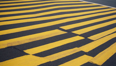 Yellow zebra crossing on the road in the city. Horizontalの素材