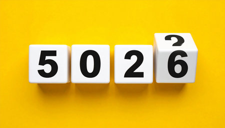 Business and finance concept. White cubes with numbers on a yellow backgroundの素材