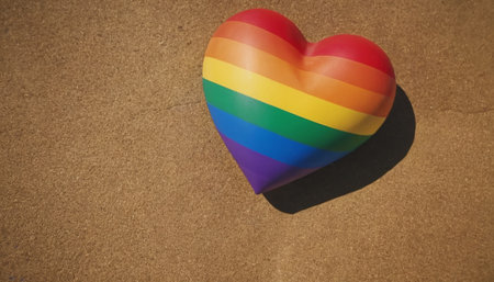 Rainbow heart on the beach with copy space. LGBT pride concept.の素材