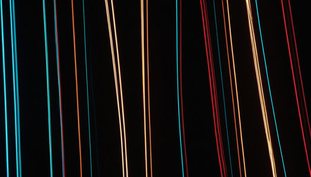 Abstract light trails on the black background. Long exposure photo taken in a tunnel.の素材