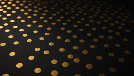 Gold polka dot on black background. Abstract background with golden dots.の素材