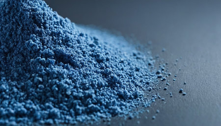 Macro shot of blue pigment powder for makeup on a black backgroundの素材