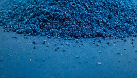 Blue eye shadow powder on blue background. Macro shot. Selective focus.の素材