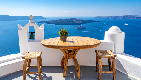 Wooden table and chairs on Santorini island, Greece.の素材
