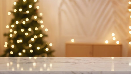 White marble table top with blurred christmas tree and bokeh backgroundの素材