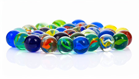 Colorful marbles on a white background. Selective focus.の素材