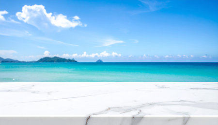 White marble table top on blur tropical beach background - can be used for display or montage your productsの素材