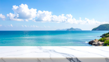 White marble table top with sea and blue sky background. For product displayの素材