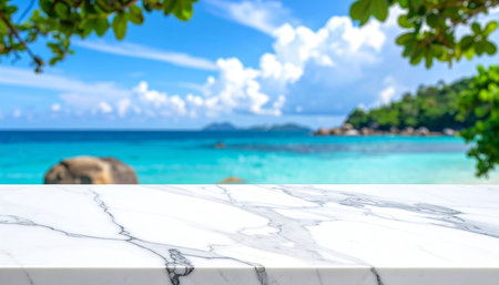 White marble table top with blur tropical beach background - can be used for display or montage your productsの素材