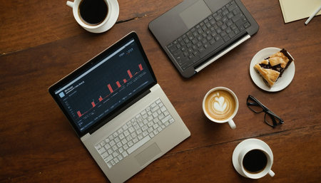 High angle view of a laptop and coffee on a table in officeの素材