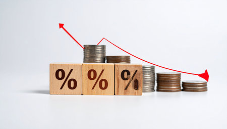 Percentage symbol on wooden cube with stack of coins, business conceptの素材