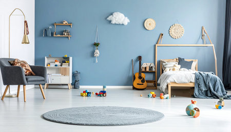 Interior of child room with blue wall, carpet, armchair and toysの素材