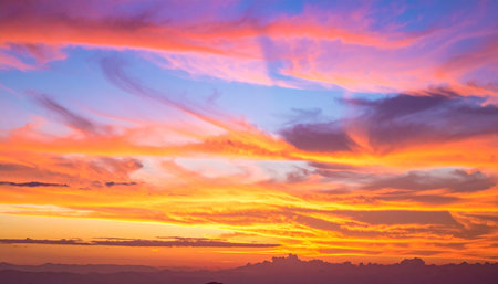 Colorful sunset in the mountains. Colorful sky with clouds.の素材