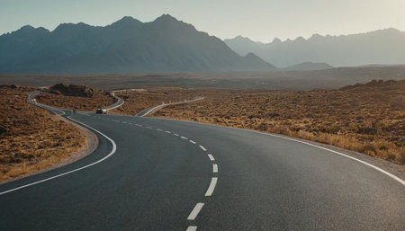 Asphalt road in the mountains at sunset. Travel and adventure concept.の素材