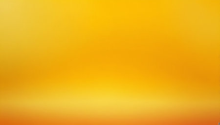 Abstract blurred gradient background in yellow and orange tones with copy space.の素材