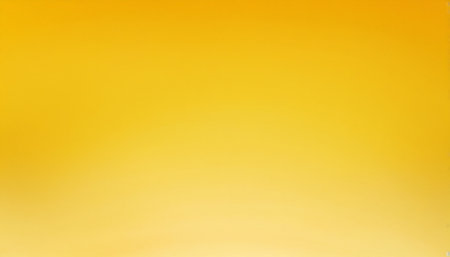 Gold gradient background. Abstract yellow gradient background for design with copy spaceの素材