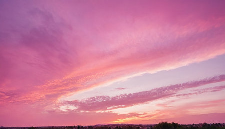 Sunset sky background. Colorful sunset sky. Sunset sky with cloudsの素材